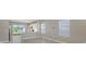Open living area showcasing tile flooring, recessed lighting, and an open floor plan with kitchen access at 10054 Cross River Trl, Parrish, FL 34219