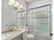 Bright bathroom with shower and tub combination, featuring a granite vanity and neutral decor at 11716 Strandhill Ct, Lakewood Ranch, FL 34202