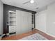 Bedroom featuring a closed Murphy bed, closet, and hardwood floors, perfect for a guest room or home office at 11716 Strandhill Ct, Lakewood Ranch, FL 34202