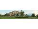 Panoramic view of a grand clubhouse with manicured lawns and lush landscaping, perfect for community gatherings at 11716 Strandhill Ct, Lakewood Ranch, FL 34202