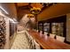 Spacious dining room boasting a long table, brick accents, and wine storage at 11716 Strandhill Ct, Lakewood Ranch, FL 34202