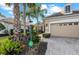 Attractive home exterior with brick-paved walkway and well-maintained landscaping at 11716 Strandhill Ct, Lakewood Ranch, FL 34202