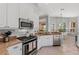 Well-equipped kitchen with stainless appliances, granite countertops, and ample cabinetry at 11716 Strandhill Ct, Lakewood Ranch, FL 34202