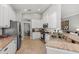 Bright kitchen with stainless steel appliances, granite countertops, and tile flooring at 11716 Strandhill Ct, Lakewood Ranch, FL 34202