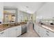 Bright kitchen with granite countertops, stainless appliances, and views of the lanai at 11716 Strandhill Ct, Lakewood Ranch, FL 34202