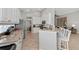 Open kitchen featuring granite countertops, stainless appliances, and breakfast bar seating at 11716 Strandhill Ct, Lakewood Ranch, FL 34202