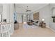 Expansive living area showcasing an open layout, neutral color scheme, and seamless integration with the kitchen and entryway at 11716 Strandhill Ct, Lakewood Ranch, FL 34202
