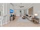 Open floor plan with living room featuring a sofa, tiled floors, decorative elements, and access to the front entrance at 11716 Strandhill Ct, Lakewood Ranch, FL 34202