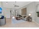 Cozy living room featuring stylish decor, an open layout, and abundant natural light, seamlessly flowing into the foyer at 11716 Strandhill Ct, Lakewood Ranch, FL 34202