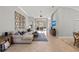 Spacious living room boasts neutral tones, tiled flooring, a comfortable sofa, and seamless access to the outdoor area at 11716 Strandhill Ct, Lakewood Ranch, FL 34202