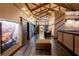 Modern lobby featuring unique wooden designs, stone walls, and decorative lighting at 11716 Strandhill Ct, Lakewood Ranch, FL 34202