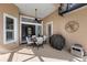 Inviting outdoor patio with a dining table, chairs, and a covered grill, perfect for entertaining at 11716 Strandhill Ct, Lakewood Ranch, FL 34202