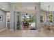 View from inside showcases a screened-in patio with a pool and dining area, offering a relaxing outdoor retreat at 11716 Strandhill Ct, Lakewood Ranch, FL 34202