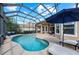 Picturesque screened-in pool area with seating, perfect for outdoor relaxation and entertainment at 11716 Strandhill Ct, Lakewood Ranch, FL 34202