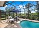 Inviting screened-in pool with comfortable lounge chairs, creating a perfect relaxation spot at 11716 Strandhill Ct, Lakewood Ranch, FL 34202