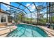 Beautifully screened-in pool with lush landscaping, offering a serene backyard oasis at 11716 Strandhill Ct, Lakewood Ranch, FL 34202