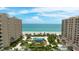Aerial view of property with beachfront access and swimming pool at 1211 Gulf Of Mexico Dr # 309, Longboat Key, FL 34228