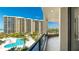 Enjoy breathtaking views of the pool and lush landscaping from this inviting open-air condo balcony at 1211 Gulf Of Mexico Dr # 309, Longboat Key, FL 34228