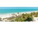 Breathtaking beach view with white sand, blue ocean, and lush landscaping, a true tropical paradise at 1211 Gulf Of Mexico Dr # 309, Longboat Key, FL 34228