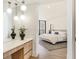Bright bedroom with a dressing area and a queen sized bed at 1211 Gulf Of Mexico Dr # 309, Longboat Key, FL 34228