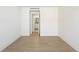 Bright and vacant bedroom with light wood floors at 1211 Gulf Of Mexico Dr # 309, Longboat Key, FL 34228