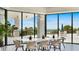 Beautiful dining area with floor-to-ceiling windows and ocean views at 1211 Gulf Of Mexico Dr # 309, Longboat Key, FL 34228