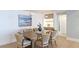 Cozy dining area with a large wooden table and seating for six at 1211 Gulf Of Mexico Dr # 309, Longboat Key, FL 34228