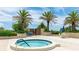 Relaxing hot tub near the ocean with palm trees and lounge chairs at 1211 Gulf Of Mexico Dr # 309, Longboat Key, FL 34228