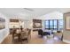 Beautiful living room featuring hardwood floors, dining area, and ocean view at 1211 Gulf Of Mexico Dr # 309, Longboat Key, FL 34228