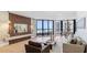 Bright and airy living room showcasing a stylish accent wall and an ocean view at 1211 Gulf Of Mexico Dr # 309, Longboat Key, FL 34228