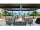 Comfortable outdoor seating area with ocean views and dining tables at 1211 Gulf Of Mexico Dr # 309, Longboat Key, FL 34228