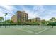 Well-maintained community tennis courts surrounded by lush tropical landscaping at 1211 Gulf Of Mexico Dr # 309, Longboat Key, FL 34228