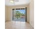 Empty room with balcony access showcases tile flooring and natural light at 1268 11Th St # 2402, Sarasota, FL 34236