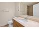 Well-lit bathroom featuring a toilet, vanity with a sink, and a tiled shower enclosure at 1268 11Th St # 2402, Sarasota, FL 34236