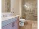 Well-lit bathroom featuring a glass-door shower and modern sink with stylish faucet at 1268 11Th St # 2402, Sarasota, FL 34236