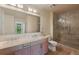 Luxurious bathroom with dual sinks, and a frameless glass shower, designed for comfort at 1268 11Th St # 2402, Sarasota, FL 34236