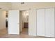 Inviting bedroom with bi-fold closet doors with open doorway revealing an ensuite bathroom at 1268 11Th St # 2402, Sarasota, FL 34236