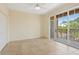 Neutral bedroom with patio access, tile flooring, and a spacious closet, perfect for a serene retreat at 1268 11Th St # 2402, Sarasota, FL 34236