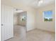 Bright and airy bedroom featuring tile flooring and an open doorway at 1268 11Th St # 2402, Sarasota, FL 34236