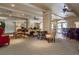 Spacious clubhouse featuring comfortable seating areas, ceiling fans, and bar for relaxation and entertainment at 1268 11Th St # 2402, Sarasota, FL 34236