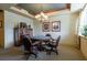 Inviting game room with card table, chairs, and elegant chandelier, offering a space for leisure and recreation at 1268 11Th St # 2402, Sarasota, FL 34236