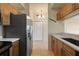 Charming kitchen features wooden cabinets, stainless steel appliances, and ample countertop space at 1268 11Th St # 2402, Sarasota, FL 34236