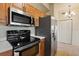 Updated kitchen features stainless steel appliances and white countertops, perfect for cooking at 1268 11Th St # 2402, Sarasota, FL 34236