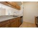 Well-lit kitchen featuring ample cabinetry, countertop space and stainless steel appliances at 1268 11Th St # 2402, Sarasota, FL 34236