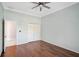 Bedroom with hardwood floors, closet, and light blue walls at 13 Bayhead Ln, Osprey, FL 34229