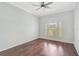 Bedroom with hard wood floors and bright window letting in natural light at 13 Bayhead Ln, Osprey, FL 34229