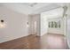 Spacious bedroom featuring hardwood floors, large window, and decorative lighting at 13 Bayhead Ln, Osprey, FL 34229