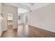 Bedroom with hardwood floors, access to the outdoor patio, and a walk-in closet at 13 Bayhead Ln, Osprey, FL 34229