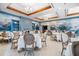 Formal dining room with elegant seating arrangements and decorative wall mural at 13 Bayhead Ln, Osprey, FL 34229