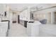 Open Kitchen featuring an island with a marble countertop and a view of the living room at 13 Bayhead Ln, Osprey, FL 34229